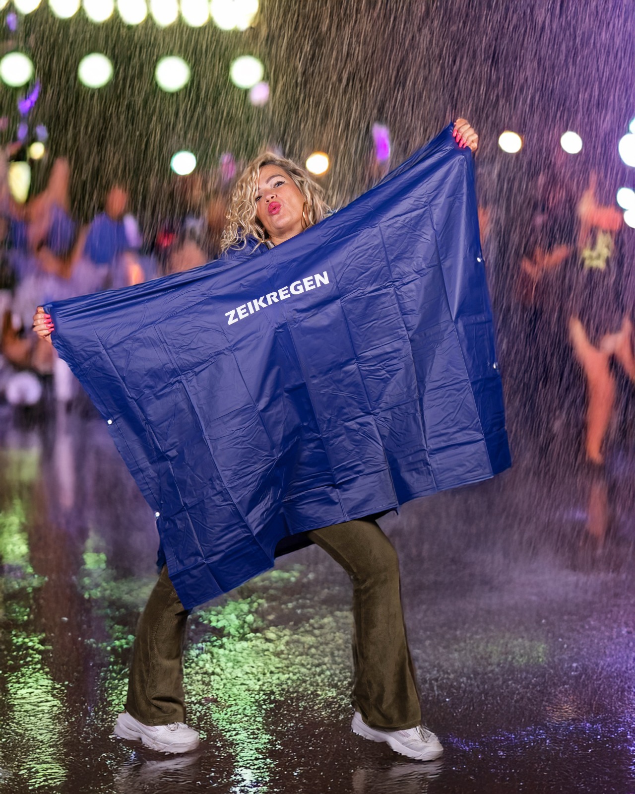 Poncho met tekst zeik regen